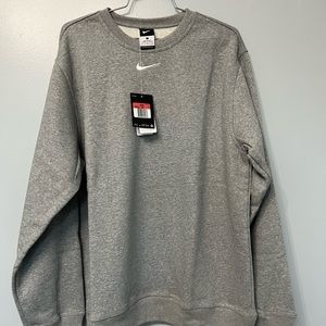 Nike crewneck gray sweatshirt with soft fleece lining.